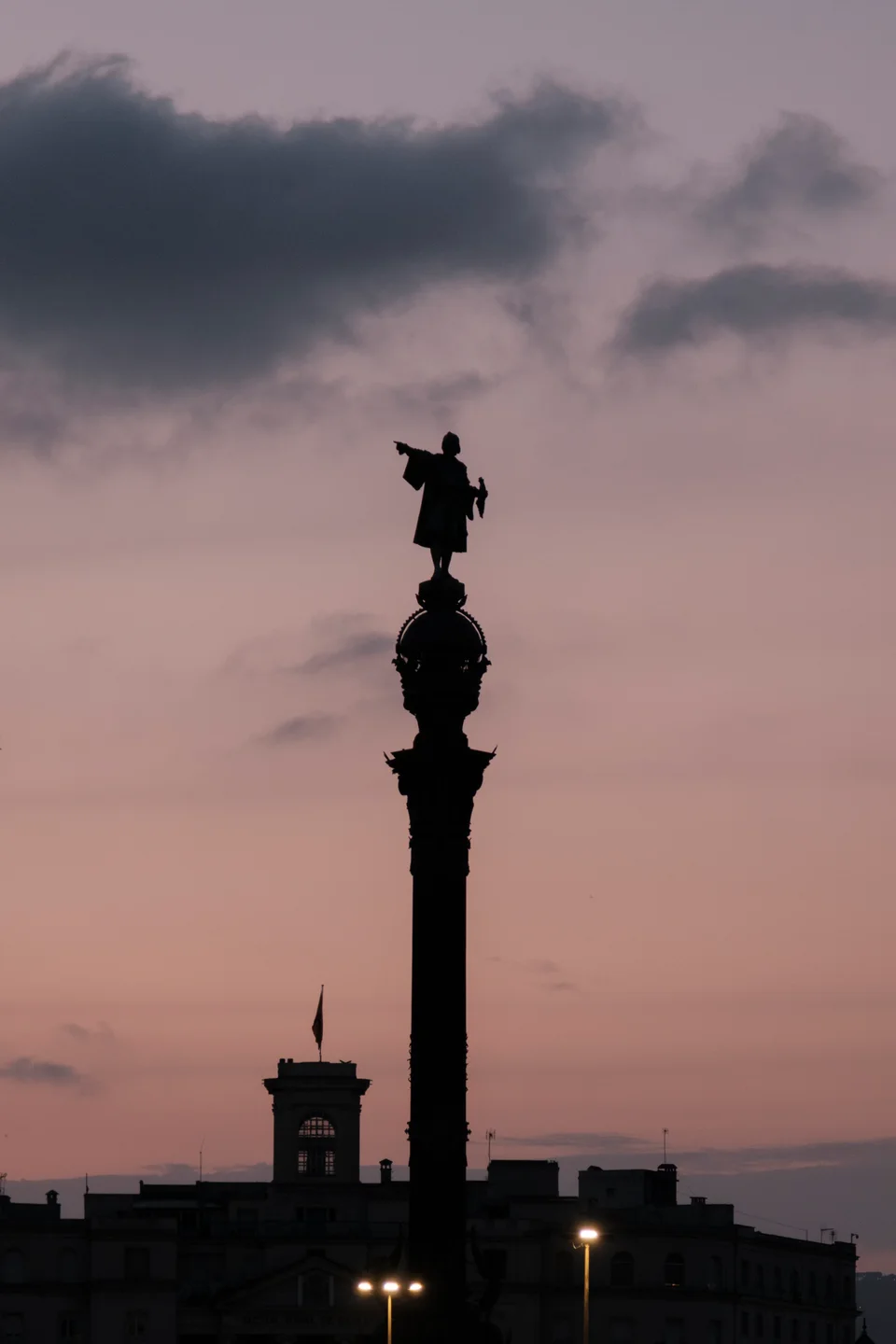 Monument silhouette against a pink evening sky
