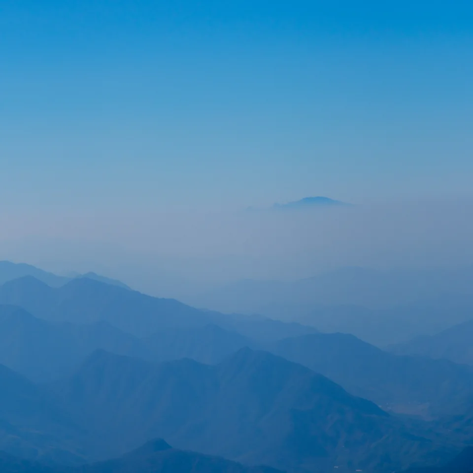 Layers of blue mountains fading into mist