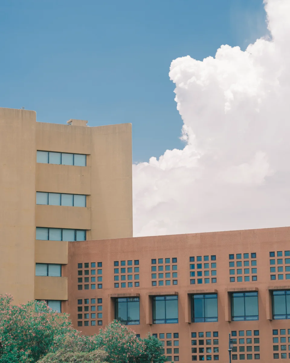 Geometric building and a large white cloud
